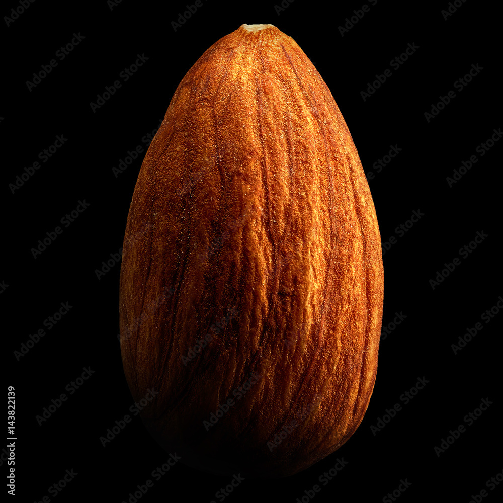 Wall mural almond isolated on black background with reflection. close-up or macro. health concept - Wall murals