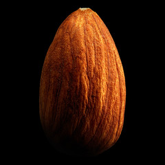 Almond isolated on black background with reflection. Close-up or macro. Health concept