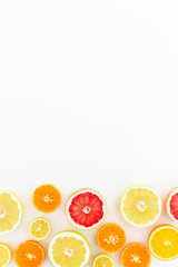 Frame of citrus fruits on white background. Flat lay, top view.