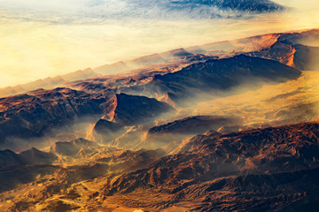 Fototapeta na wymiar Aerial view from air plane of desert mountains