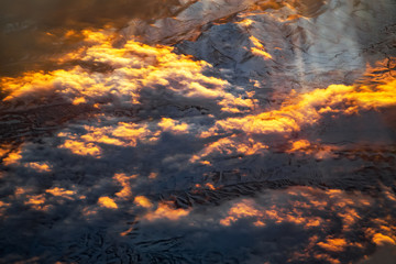 Sunset clouds, view from above air plane window