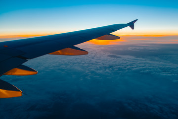 Fototapeta premium Aerial view from airplane window at sunset
