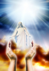 Jesus Christ in two hands over divine sky with rays of Light like y asymbol of Christianity, love, peace, blessing 
