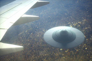 UFO - Unidentified Flying Object. Alien spaceship flying together with airplane. © ktsdesign