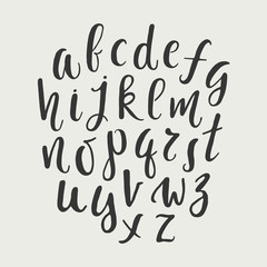 Modern hand drawn lower case vector alphabet on dark background. Calligraphy letters. Typography font.