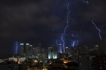 Tropical thunderstorm at night over Miami with massive lightning. Florida. USA