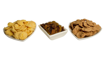 Corn flakes, buckwheat flakes, raisins in a plate. breakfast. Healthy food, diet.