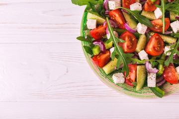 Traditional Bulgarian salad Shopski with fresh vegetables and feta
