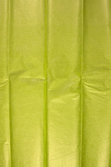 This is a closeup photograph of Green Tissue paper