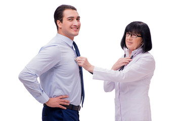 Experienced doctor examining young man isolated on white