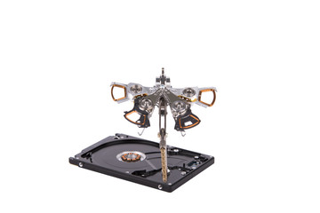 Isolated metal dragonfly made by hand from parts of old hard drive, steampunk, white background