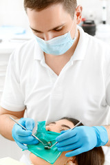 Professional dentist working at his clinic