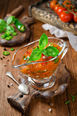 Sauce from tomato, paprika, chili pepper and a branch of basil