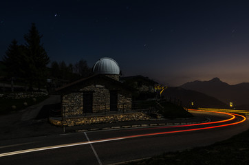 Fototapeta na wymiar Astronomical Observatory with auto wake and starry sky.