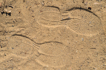 Fototapeta na wymiar Schuhabdrücke in Sand
