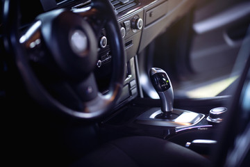 Obraz na płótnie Canvas Luxury car interior. Automatic shift lever. 