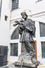 A view of a statue of the Franciscan monastery entrance in Prague