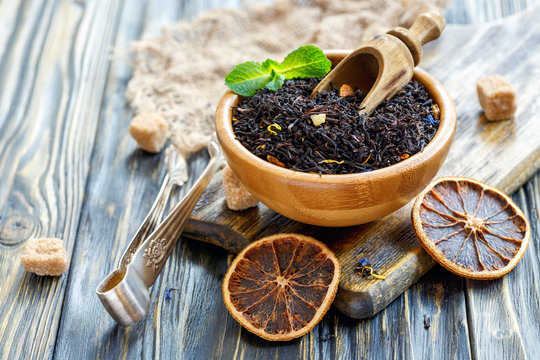 Black Tea With Bergamot In A Wooden Bowl.