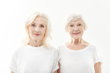 Cheerful two senior ladies expressing positivity