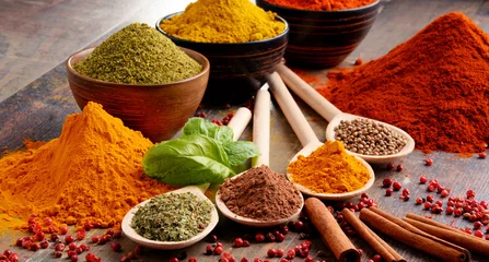 Keuken foto achterwand Variety of spices on kitchen table © monticellllo