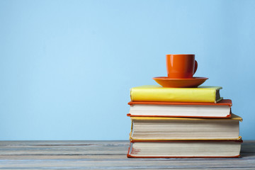 Stack of books on wooden table. Education background. Back to school.Copy space for text.