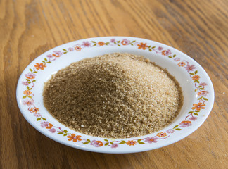 Brown sugar in a decorated deep dish