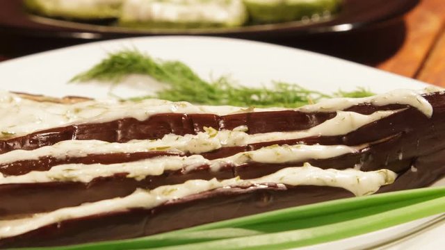 Eggplant snack with with garlic sauce, cooked in the oven. Sauce with garlic, cheese and mayonnaise.