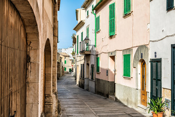 Fototapeta na wymiar Mediterranean street in Alcudia Old Town, Majorca Balearic island of Spain