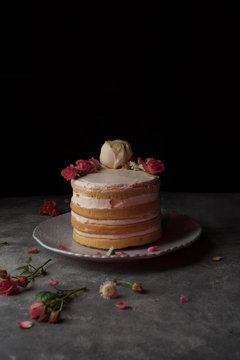 Delicious cake decorated with natural roses
