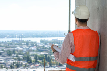 Engineer looking over the city from the construction site