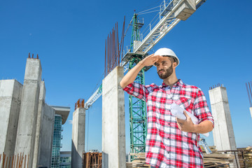 Handsome engineer at the construction site