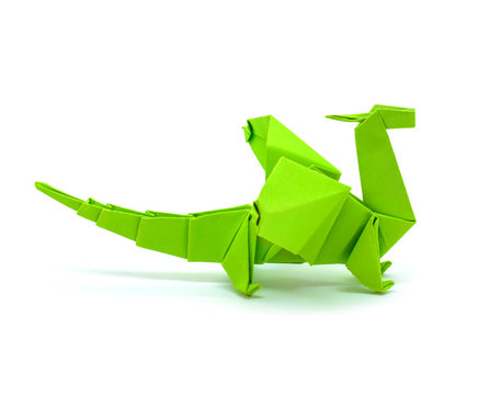 Photo of origami green dragon isolated on white background