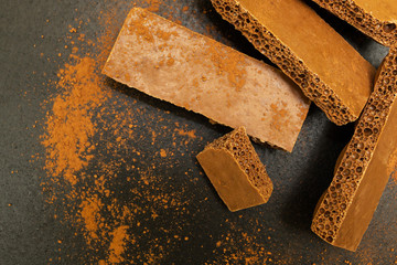 Porous chocolate on a black background
