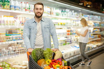 Lovely young couple at the supermarket