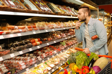 Handsome male at the groceries store