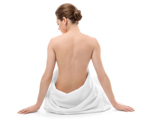 Beautiful naked woman with towel on white background © Africa Studio