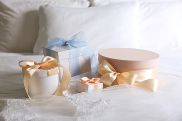 Fototapeta na wymiar Gift boxes for wedding day on bed