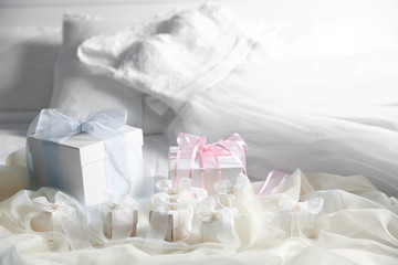 Fototapeta na wymiar Gift boxes for wedding day on bed