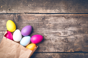 Easter Eggs on old boards. Painted eggs. Old board background. Easter ideas. Easter eggs. Space for text. Image in trendy toning.