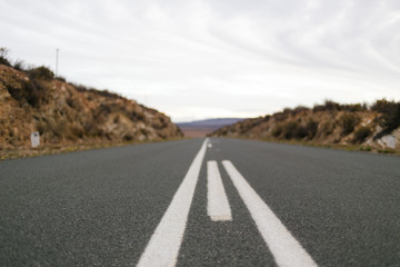 Tar road leading off into the distance on a very quite road