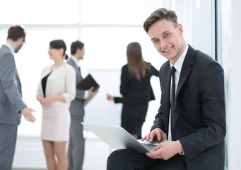 Face of handsome businessman on the background of business peopl