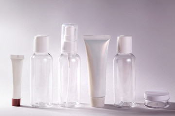 White cosmetic bottles on white background. Wellness, spa and body care bottles collection. Beauty treatment