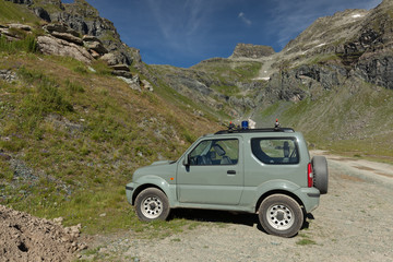 Obraz na płótnie Canvas Off Road car in mountains. Italian Alps