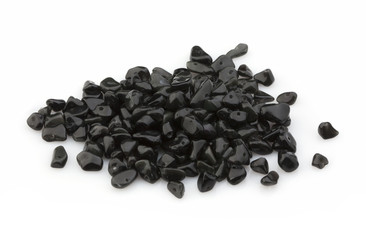 Natural stones of crumb black agate for decoration on a white background. Isolated