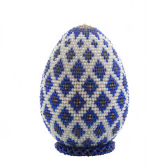 Easter egg made from beads on a white background. Isolated. Festive decoration. Happy Easter!
