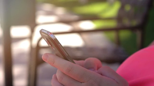  High quality video of woman using mobile phone in 4K