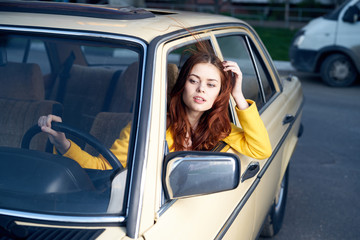 woman in yellow shirt, driver, car