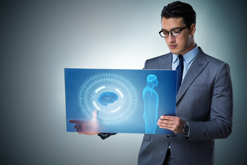 Futuristic remote diagnostics concept with businessman