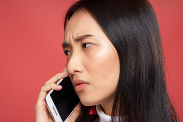 offended woman holding the phone near the face