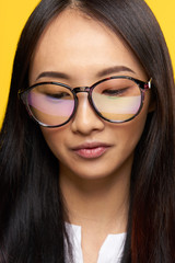 Fototapeta premium beautiful brunette with glasses looking down